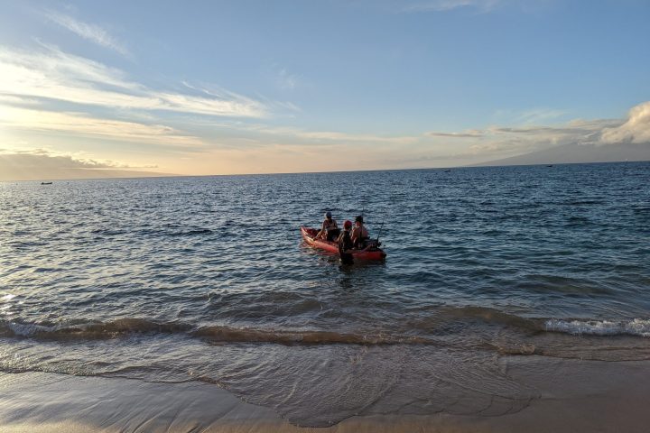 a sandy beach next to a body of water